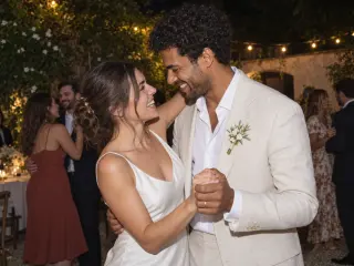 The couple dancing under the lights.